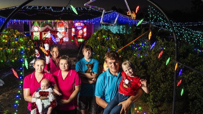 Proud of their Southbrook Christmas light display are (from left) Hayley Kimball holding Hunter Kimball, Kristy Kimball, Taylah Kimball, Isaiah Watts holding Coco and Kevin Stepney and holding Makala Watts, Saturday, December 11, 2021. Picture: Kevin Farmer