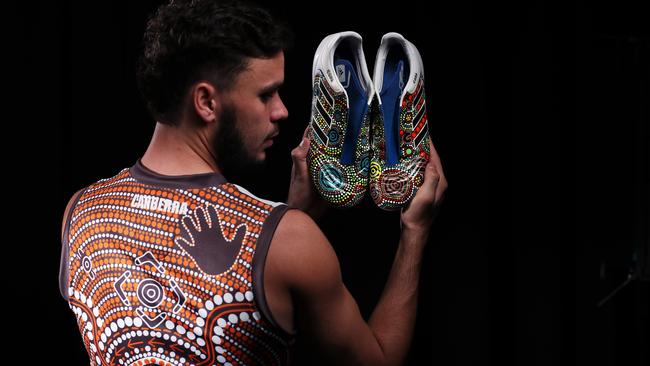 Zac Williams in GWS’s Indigenous Round guernsey and the special boots he’ll be wearing. Picture: Phil Hillyard