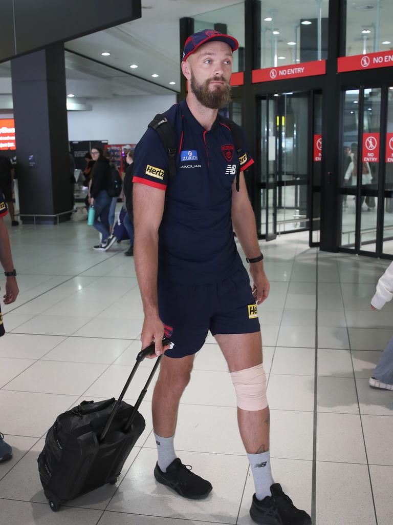 Max Gawn arrives back in Melbourne with his knee bandaged on Saturday. Picture: David Crosling