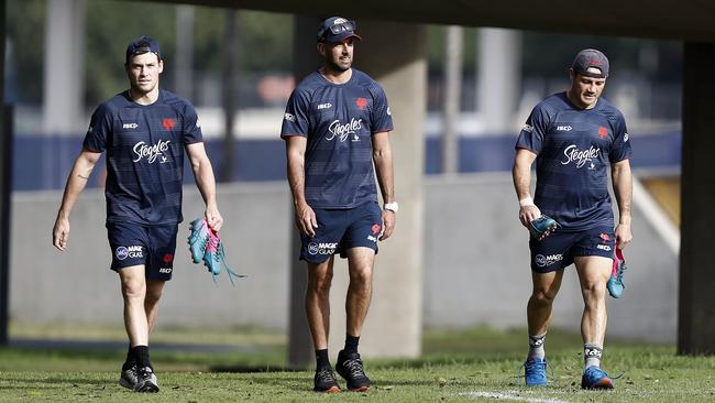 Nick Davis (centre) will make the transition from the Roosters’ coaching staff to playing for the team.