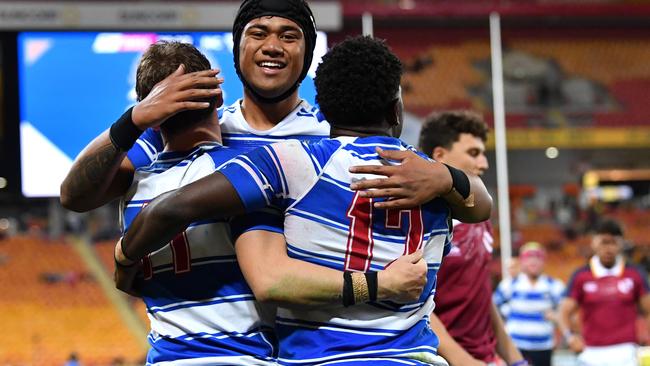 Daniel Maiava Nudgee College celebrates scoring a try (AAP Image/Darren England)