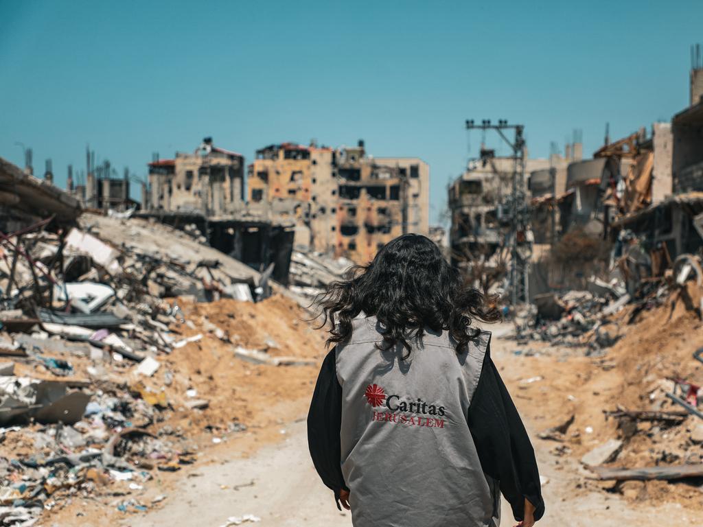 An aid worker walks through Gaza. Picture: Caritas Jerusalem