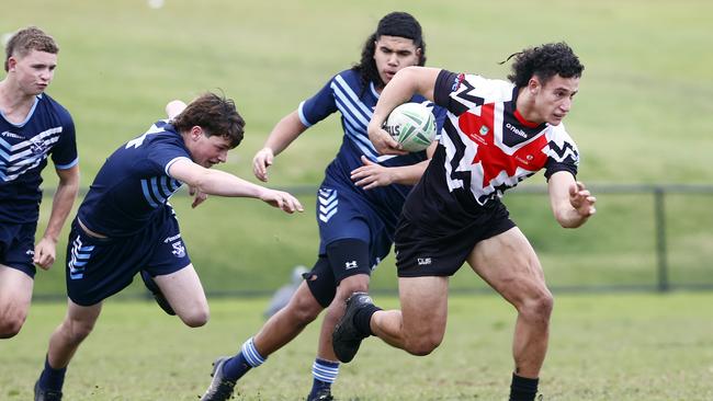 Blake Hovi bursts through the Matraville defence.