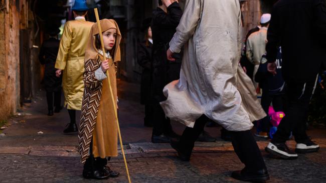 A Jewish boy celebrates the holiday of Purim, which commemorates the saving of the Jewish people in ancient Persia. Picture: Getty