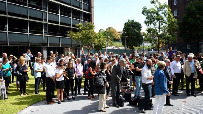 Editorial staff assemble after walking out of Fairfax Media headquarters in Sydney. Picture: AAP