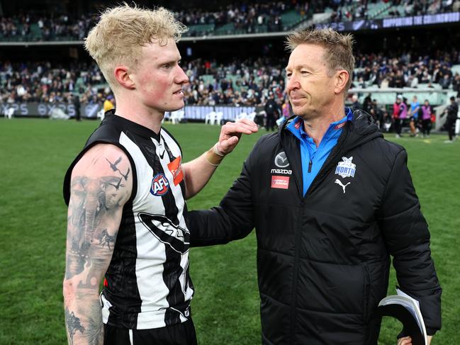 John and David Noble embrace after a match between Collingwood and North Melbourne in 2022. Picture: Michael Klein