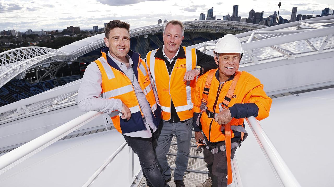 Project managers from John Holland, Lee Djusic and Paul Cassel and John Neilsen from QRSA pictured on the stadium gantry. Picture: Sam Ruttyn