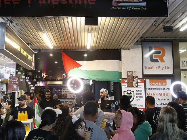 SYDNEY, AUSTRALIA - NewsWire Photos MARCH 15, 2024: Left:  L to R: Brothers Shade and Mohammad Zarqa sport the Free Palestine message at their Yummy Yummu Knafeh shop   at  Ramadan Nights Lakemba Markets.  Picture: NCA NewsWire / John Appleyard
