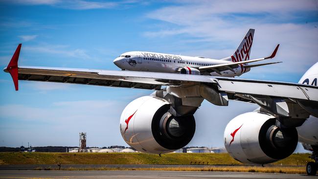 Qantas and Virgin Australia planes at Sydney Airport.