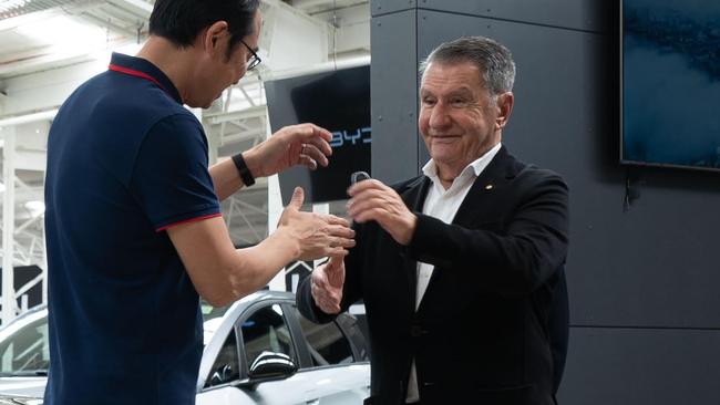 BYD Asia Pacific head of sales, Liu Xueliang, hands over the BYD Seal Politis.