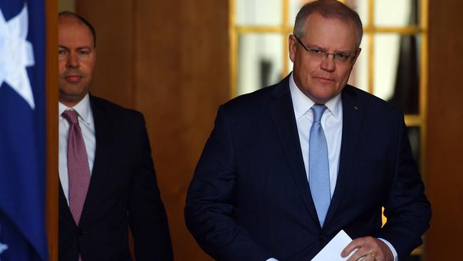 Treasurer Josh Frydenberg (left) and Prime Minister Scott Morrison arrive for a media conference on Australia’s latest unemployment figures. Picture: Getty Images