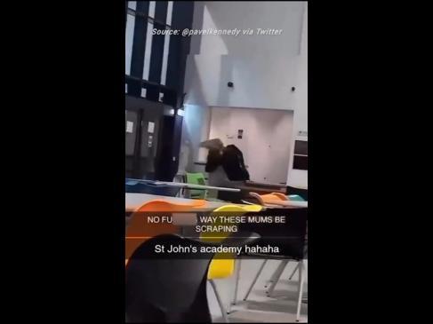 Shock video shows mums wrestling inside school as police probe brawl