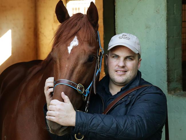 Trainer Bryce Heys with June Stakes runner Spieth at his Warwick Farm stables in Sydney. Pic Brett Costello