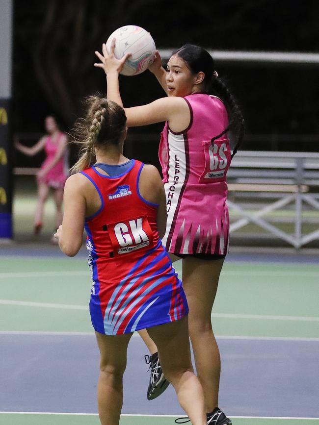 Sera-Lee Tikitau looks to offload the ball in the Cairns Netball Association match between Leprechauns and Sharks. PICTURE: BRENDAN RADKE