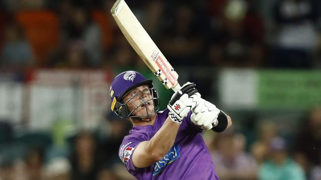 CANBERRA, AUSTRALIA - JANUARY 18: Ben McDermott of the Hobart Hurricanes hits a six during the Big Bash League match between the Sydney Thunder and the Hobart Hurricanes at Manuka Oval, on January 18, 2021, in Canberra, Australia. (Photo by Darrian Traynor/Getty Images)