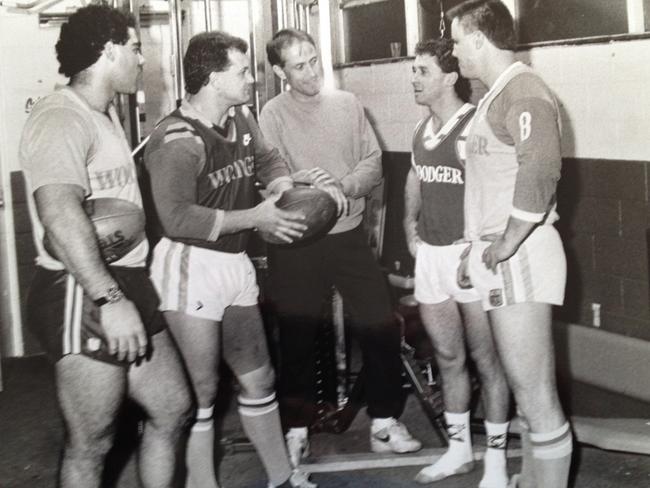 Canberra Raiders chaplain Father John Woods with Canberra players Mal Meninga, Dean Lance, Ricky Stuart and Glenn Lazarus at a training session at Seiffert Oval in 1989.