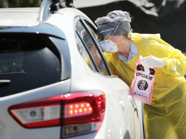 A doctor conducts drive up COVID-19 tests outside at General Practitioners at Maroubra in Sydney.Picture: Richard Dobson