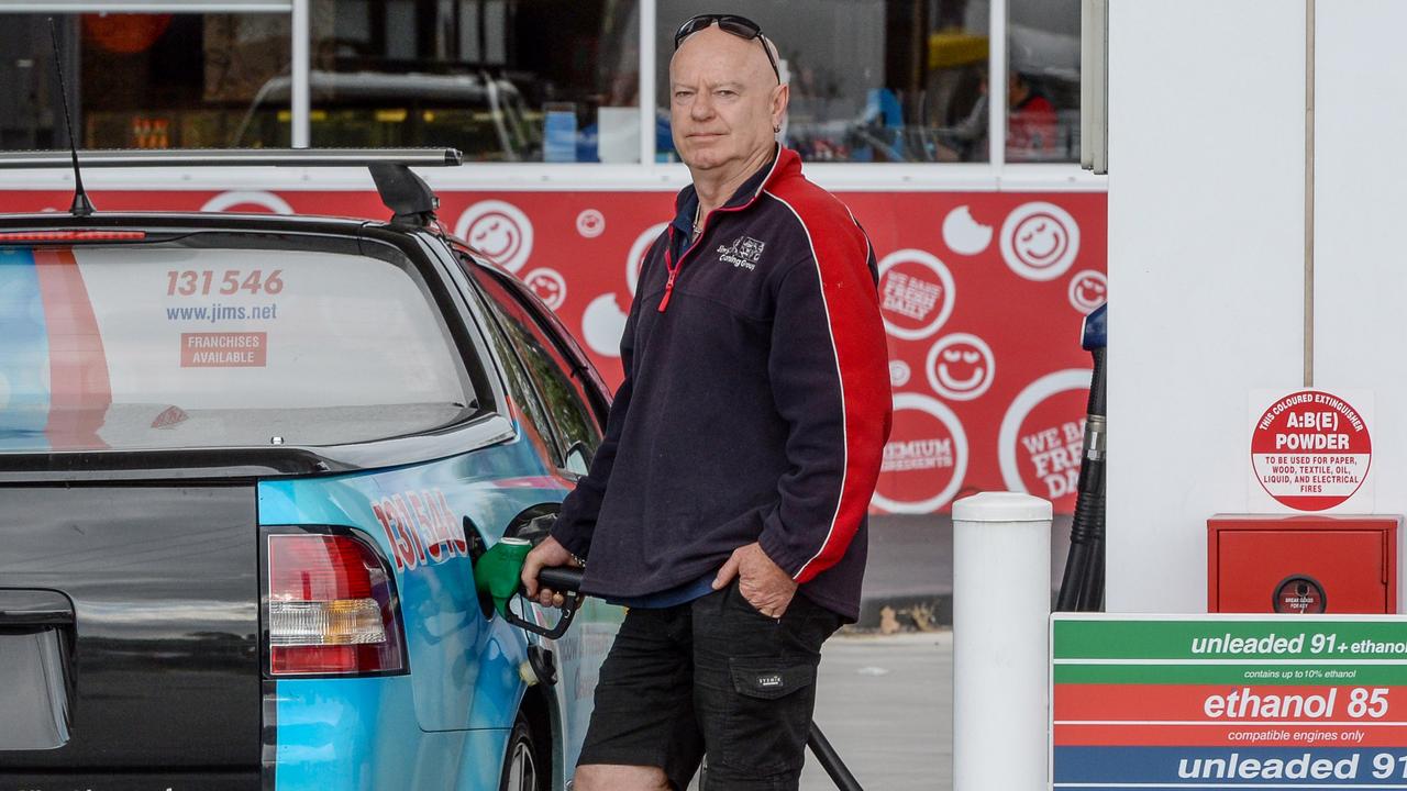 Jeff Starr fills up at the United petrol station at Flinders Park as the fuel price spikes. Picture: Brenton Edwards