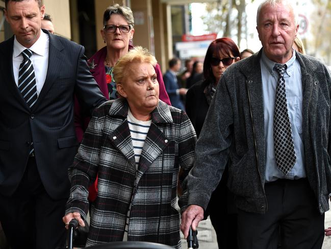 Julie Maybury and her husband Bruce (right) outside the Melbourne Magistrates’ Court after the man charged with the 1984 rape and murder of Julie’s six-year-old daughter Kylie in 2017. Picture: Nicole Garmston