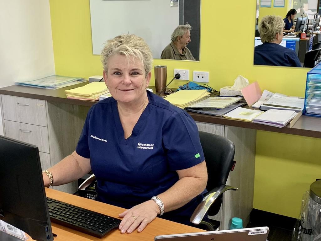 Mackay registered nurse Alison Cooper checking in patients at the new vaccination hub at CQUniversity's Mackay city campus. Picture: Rae Wilson