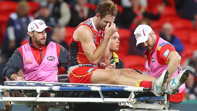 Michael Barlow is stretchered from the field during the last quarter of Gold Coast’s loss. Picture: Getty