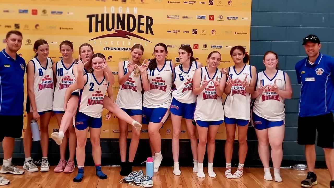 The Toowoomba Mountaineers under-16 girls squad celebrate a win.