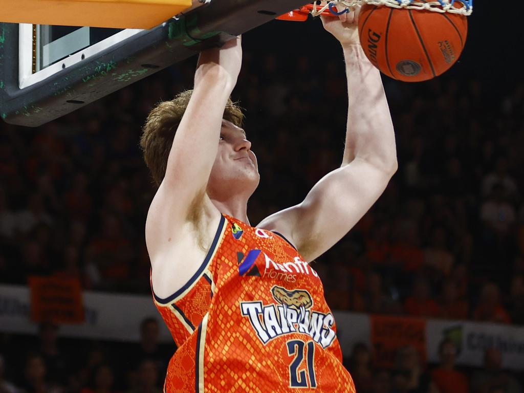 Sam Waardenburg slam dunks the ball in the National Basketball League (NBL) match between the Cairns Taipans and the Illawarra Hawks, held at the Cairns Convention Centre. Picture: Brendan Radke