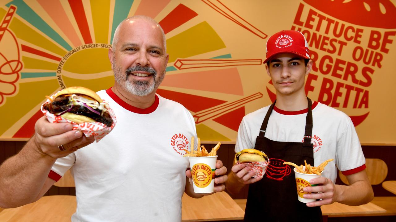 Getta Betta Coffee + Burger managing director Rob Aumend with a Brisket Burger and Nicolai Robinson with a Signature Cheese Burger. Picture: Evan Morgan