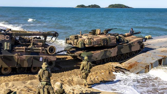 Soldiers from the Australian Amphibious Force use an M88 Recovery Vehicle to drive an M1A1 Abrams onto a MEXEFLOTE in a recovery scenario, off the coast of North Queensland as part of the Wet and Dry Environmental Rehearsals. Picture: Defence Media