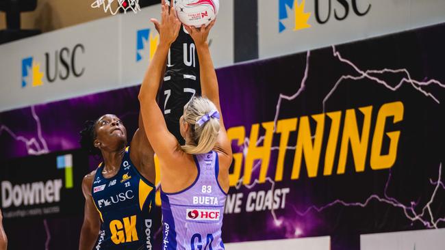 Lightning goal keeper Kadie-Ann Dehaney defends against Firebirds star Gretel Bueta.