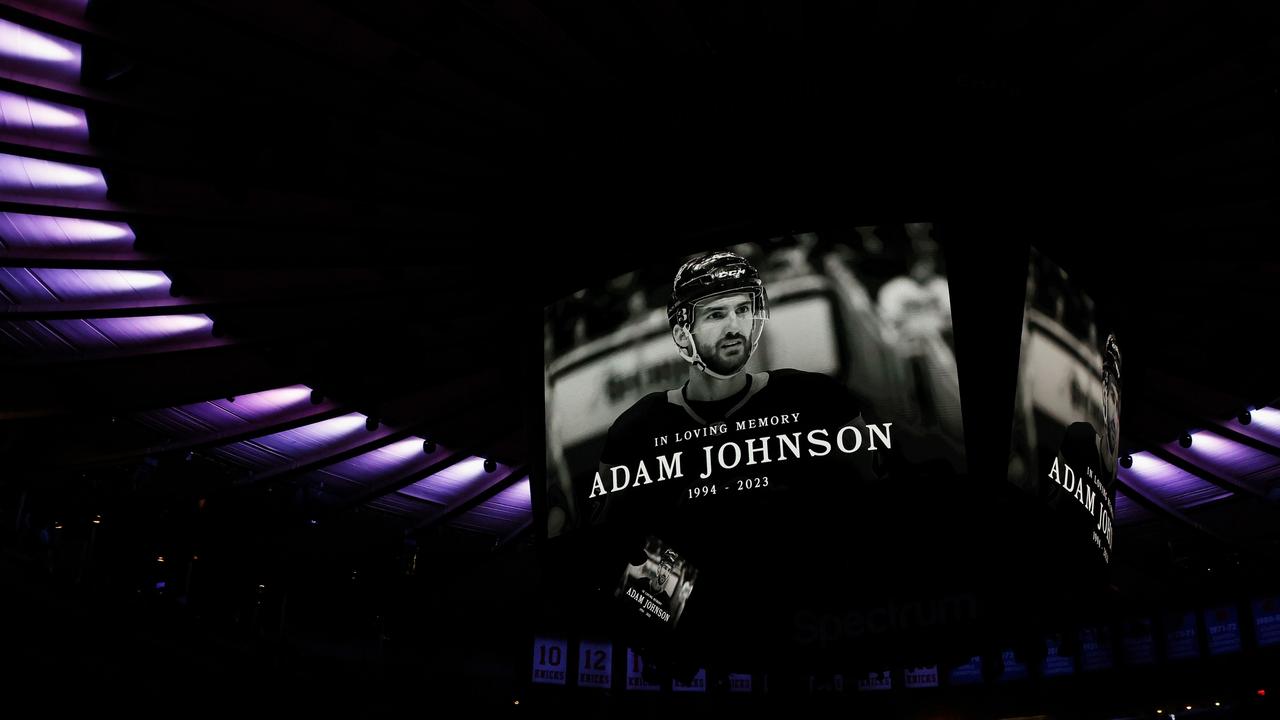 The New York Rangers and the Carolina Hurricanes hold a moment of silence for Adam Johnson prior to their game at Madison Square Garden on November 2, 2023 in New York City. (Photo by Bruce Bennett/Getty Images)