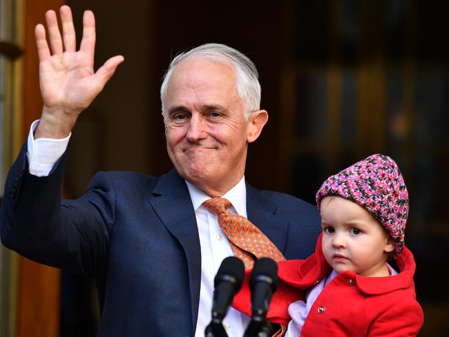 Mr Turnbull and granddaughter Alice leave after his farewell press conference at Parliament House. Picture: AAP