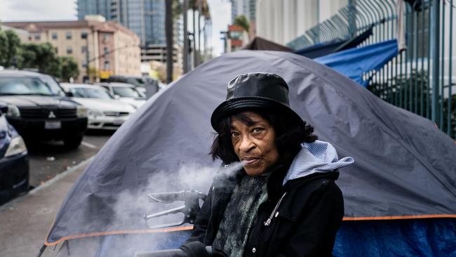 A homeless woman who has just arrived from the midwest smokes fentanyl outside her tent in San Diego, California. Picture: Melina Mara/The Washington Post via Getty Images