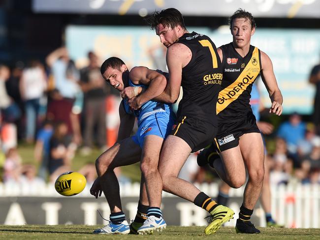 Sturt’s Matthew Crocker being tackled by Tigers’ Liam McBean. Picture: Roger Wyman