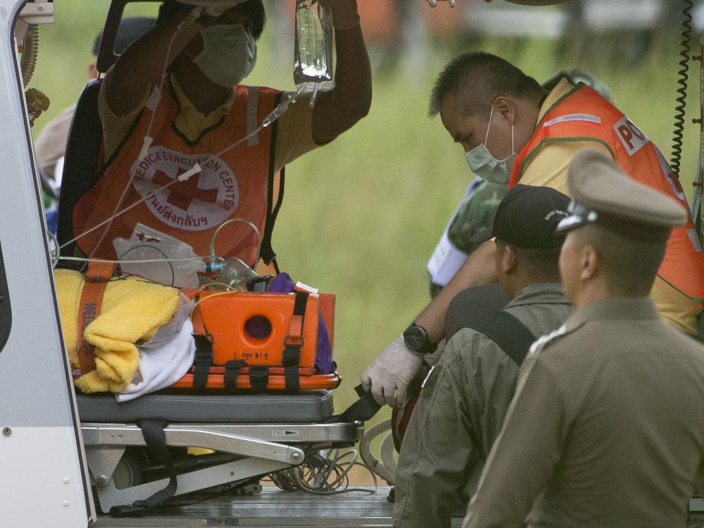 The final boys are taken to the helicopter on a stretcher bound for Chaing Rai hospital. Picture: Dan Charity
