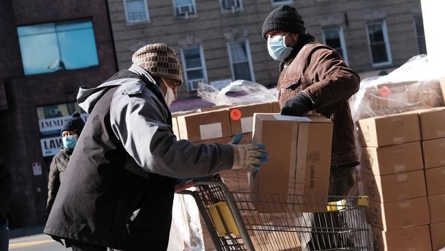 People receive food outside of a Brooklyn mosque on January 29 in New York City. Picture: AFP