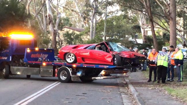 The wrecked vehicle is transported from scene. Picture Michael Akkari.