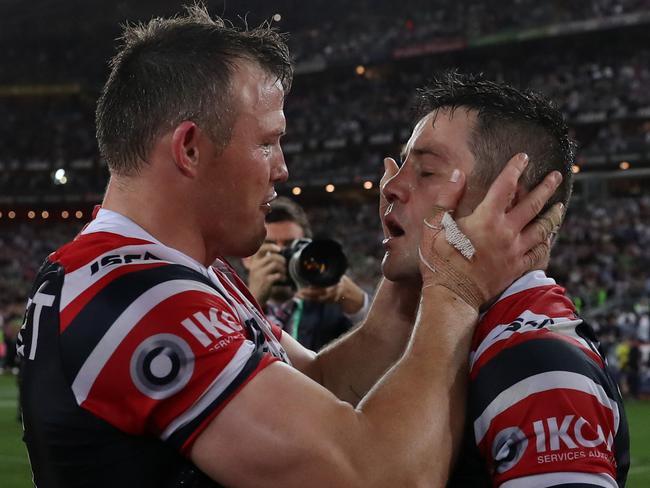 Brett Morris and Cooper Cronk celebrates victory at full time after the 2019 NRL Grand Final between the Sydney Roosters and Canberra Raiders at ANZ Stadium, Sydney. Picture: Brett Costello