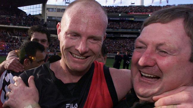 Dean Wallis and Kevin Sheedy celebrate the Dons’ crowning glory — the 2000 premiership.