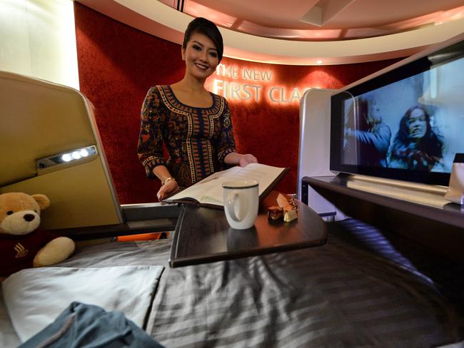 Singapore Airlines unveiled new seats and other in-flight amenities as part of a sweeping upgrade of its cabins amid intensifying competition in the industry. AFP PHOTO / ROSLAN RAHMAN