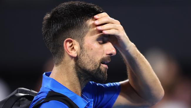 BRISBANE, AUSTRALIA - JANUARY 03: Novak Djokovic of Serbia leaves the court after losing his quarter-final match against Reilly Opelka of the USA during day six of the 2025 Brisbane International at Pat Rafter Arena on January 03, 2025 in Brisbane, Australia. (Photo by Chris Hyde/Getty Images)