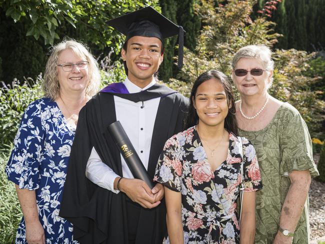 Bachelor of Laws graduate Alexander Stuart is congratulated by family (from left) Clarissa Stuart, Matia Stuart and Felicity Glasson at a UniSQ graduation ceremony at Empire Theatres, Tuesday, February 13, 2024. Picture: Kevin Farmer