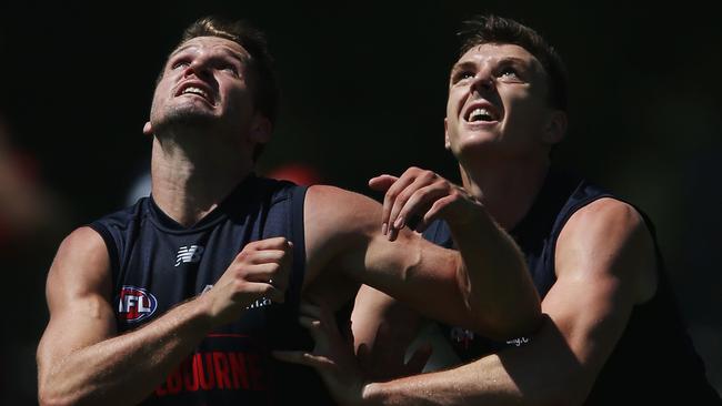 Melbourne recruit Jake Lever wrestles with Dees forward Jesse Hogan at training. Picture: Michael Dodge/Getty Images