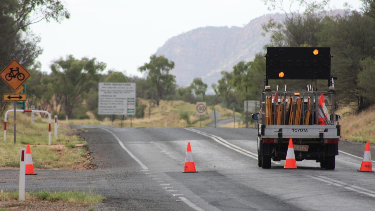 Larapinta Drive, 10km west of Flynns Grave, was closed after a two vehicle crash in which a man died, west of Alice Springs. Picture: Lee Robinson