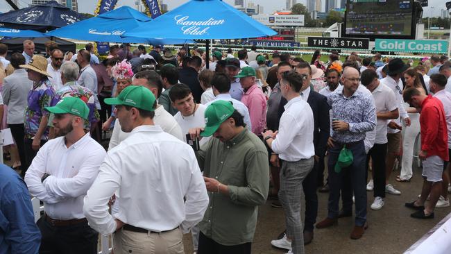 Punters waited patiently hoping the weather would clear and the meeting could proceed. Picture: Mike Batterham