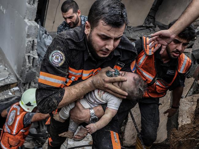 6 month-old Palestinian baby Sama Alwadia is rescued from under rubble after an Israeli air strike in Gaza Strip on October 09, 2023. Picture: Ali Jadallah/Anadolu Agency via Getty Images