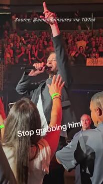 Moment Justin Timberlake angrily slaps away a fan mid-concert