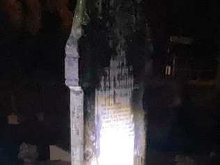 Torch lights gave an eerie glow on the Headstones