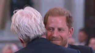 Prince Harry hugs Charles Spencer at St Paul's Cathedral.