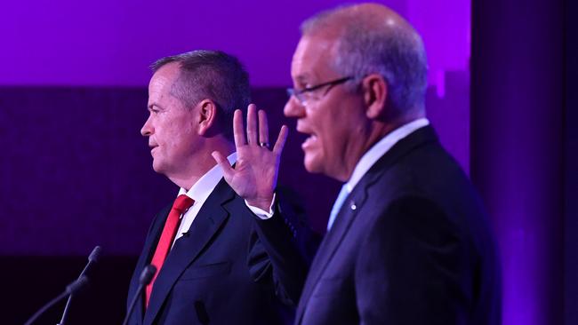 Talk to the hand … Bill Shorten reacts to a comment by Scott Morrison last night during the leaders debate at the National Press Club in Canberra. Picture: AAP